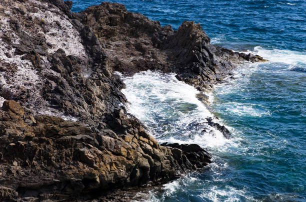 istock Coastal cliffs in the sea surf, landscape 1197421128