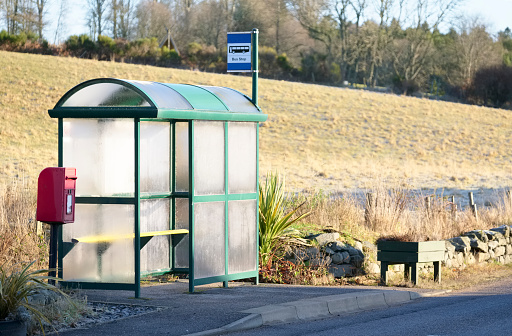 Bus stop shelter rural countryside uk public transport free travel pensioner senior person commute UK