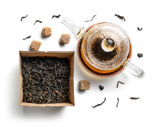 istock Teapots and tea leaves on a white background. The view from the top 1197426935