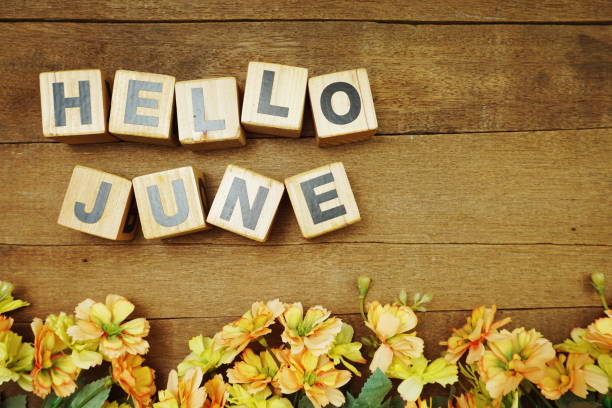 istock Hello June alphabet letters on wooden background 1197427186