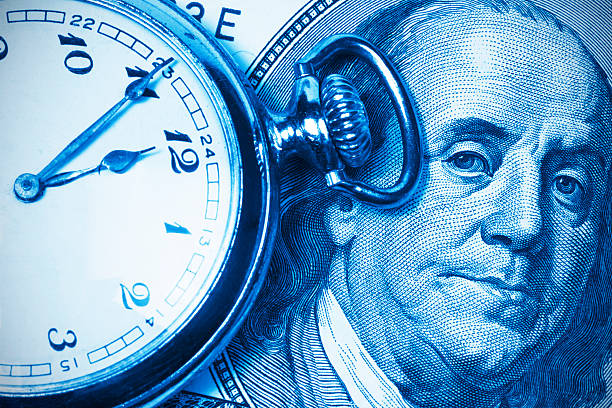 Ben Franklin and pocket watch as a business concept stock photo