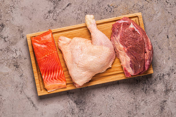 istock Meat, fish, chicken on the board 1197428459