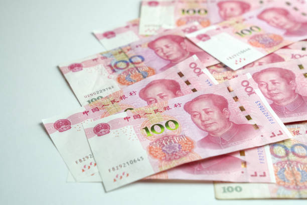 istock Chinese yuan on white background 1197430356