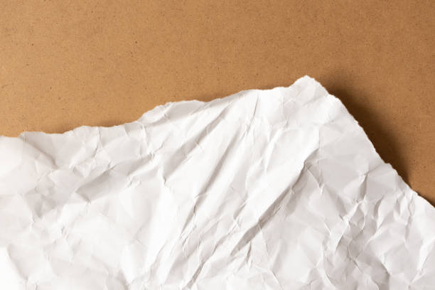 istock Mountain application, children's creativity. Torn crumpled paper on cardboard background 1197433499