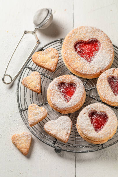 istock Cute valentine cookies with red strawberries jam 1197433712
