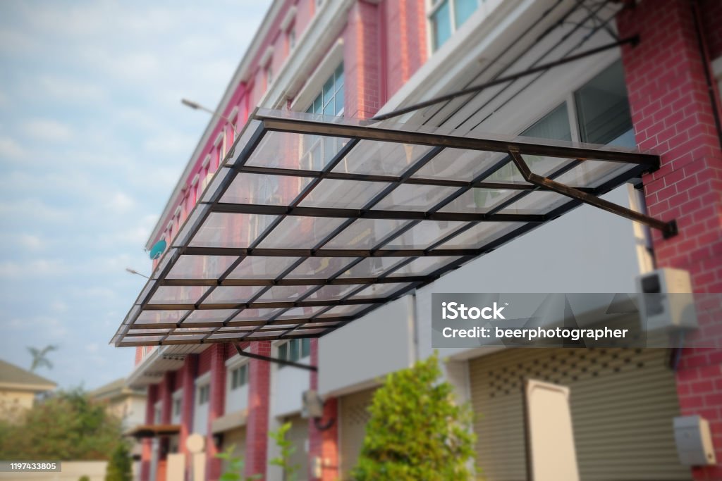 Canvas And Galvanized Awning In Front Of The Building Stock Photo - Download Image Now - iStock Canvas And Galvanized Awning In Front Of The Building Stock Photo - Download Image Now - Istock