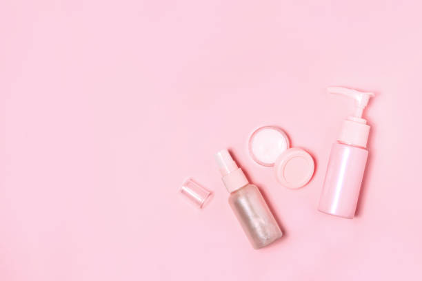 istock Cosmetic bottle containers on pink color background. 1197435922