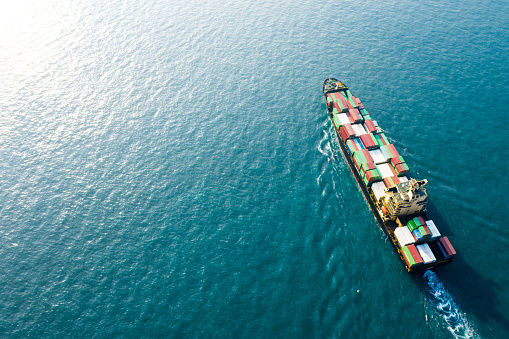 ontainer freight ship carrying container box for import and export business logistic and transportation by container ship in open sea, Aerial view