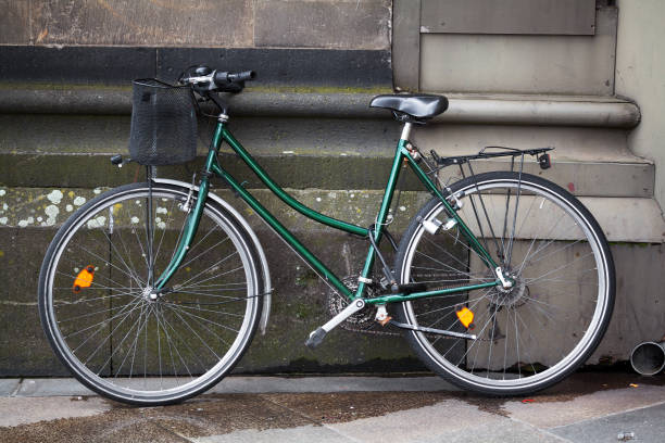istock Green bicycle leaning at church 1197438754