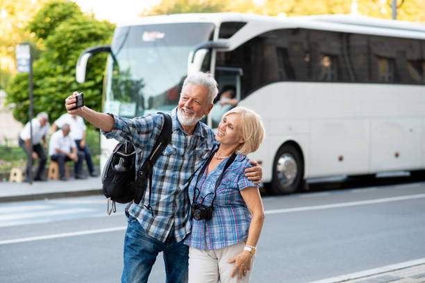 istock Cheerful senior tourists taking selfie 1197439740