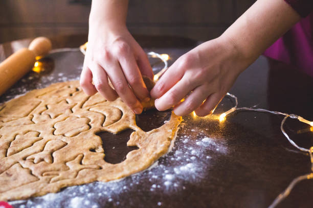 istock Woman making Christmas cookies 1197443046