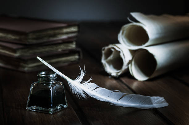 QUIll pen and old books