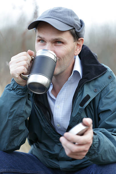 istock Man drinking tea outdoors 119744425