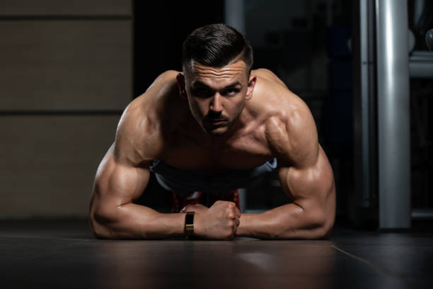 istock Young Man Doing Press Ups In Gym 1197444254