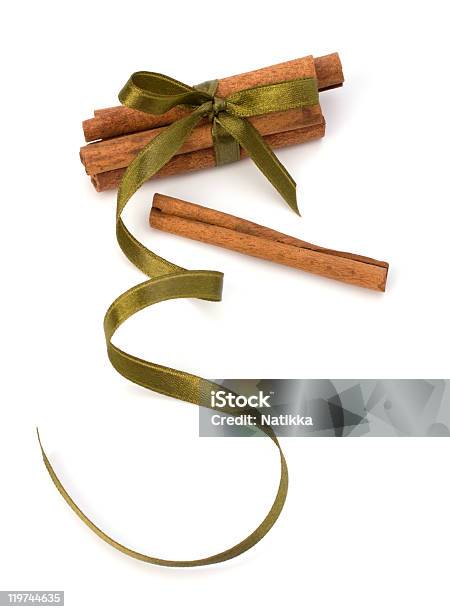 Festive Wrapped Cinnamon Sticks Stock Photo - Download Image Now - Brown, Christmas, Christmas Decoration