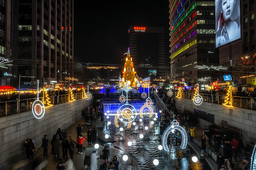 Seoul christmas festival over cheonggye plaza with the tree lit up at night over the Cheonggye stream. Taken on December 24th 2019. Seoul, South Korea