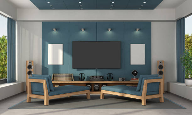 Blue home cinema of a modern villa Blue home cinema of a modern villa with tv set on concrete panels and two chaise lounges - 3d rendering
Note: the room does not exist in reality, Property model is not necessary subwoofer photos stock pictures, royalty-free photos & images