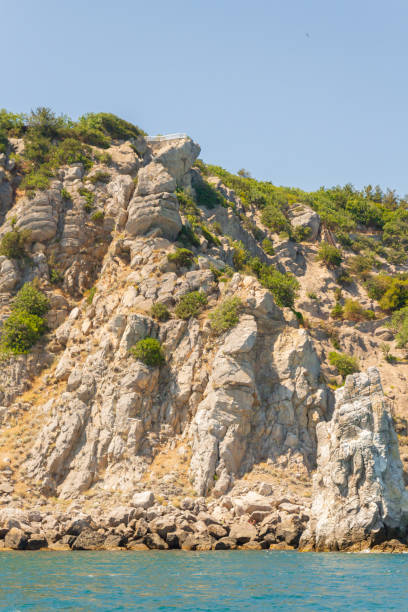 istock Mountains and rocks on the beach in summer on a Sunny day 1197451032