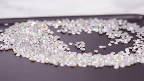 istock An abundance of white rhinestones with flat back on a black board ready 1197454621