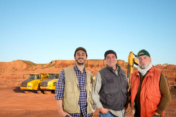 istock Young and mature workers in a road construction site 1197455115