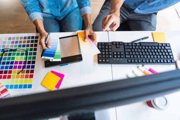 istock Midsection Of Design Professionals Working On Table 1197457675