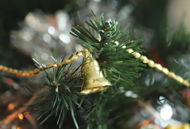 istock Christmas tree with bell ornament 1197458580