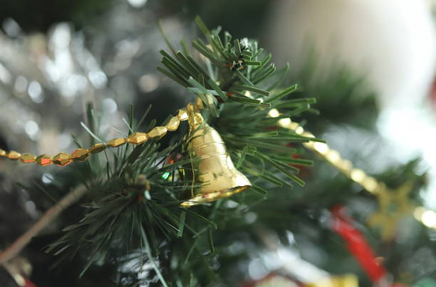 istock Christmas tree with bell ornament 1197458593