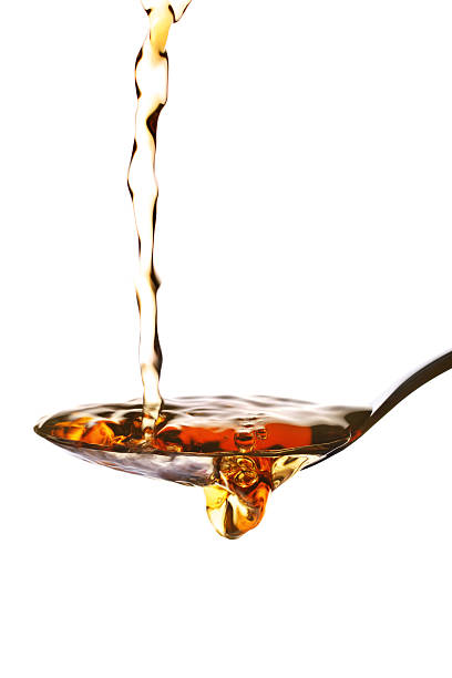 istock Malt vinegar poured in a spoon over a white background 119745896