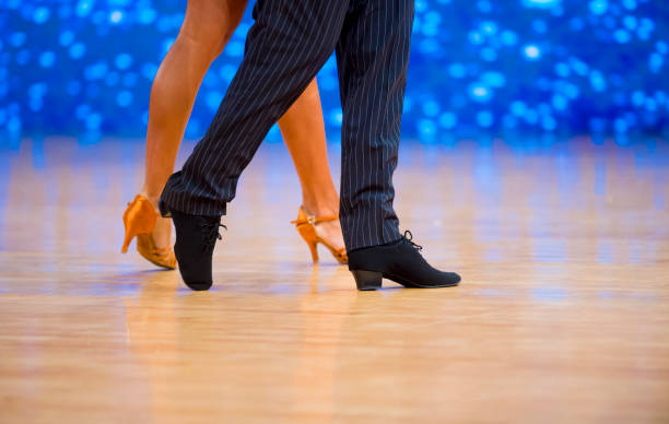 istock Low Section Of Couple Dancing On Floor 1197459491