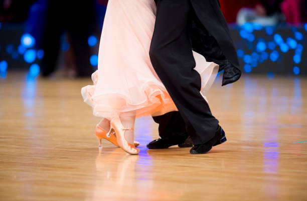 istock Low Section Of Couple Dancing On Floor 1197459610