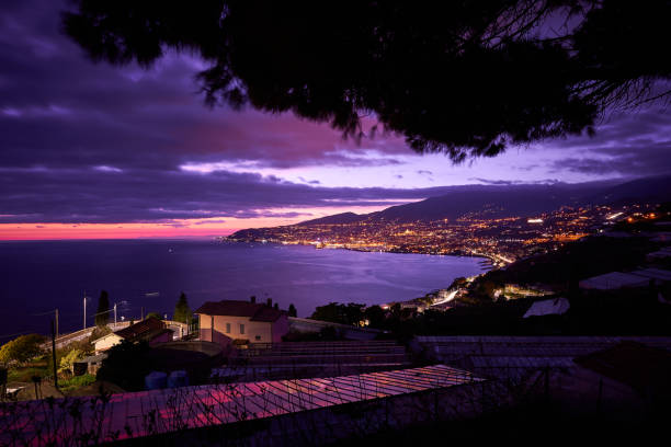 Sanremo, S. Sanremo Panoramic night view of Sanremo and the Ligurian coast (Italy, Mediterranean sea). This town is famous in the world for flowers cultivation and for the annual Italian song festival. san remo italy photos stock pictures, royalty-free photos & images