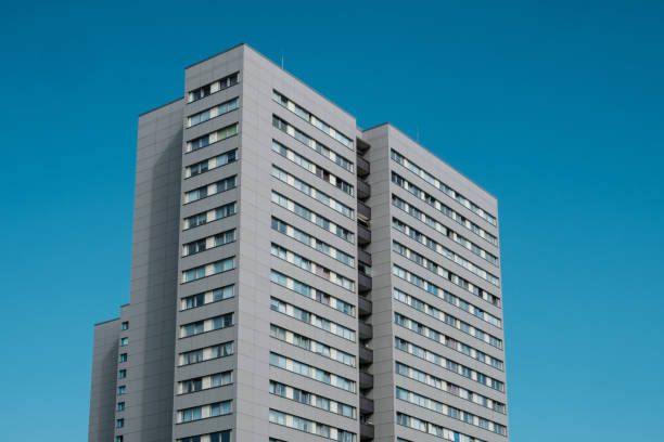 istock high rise apartment building on blue sky  - 1197461138