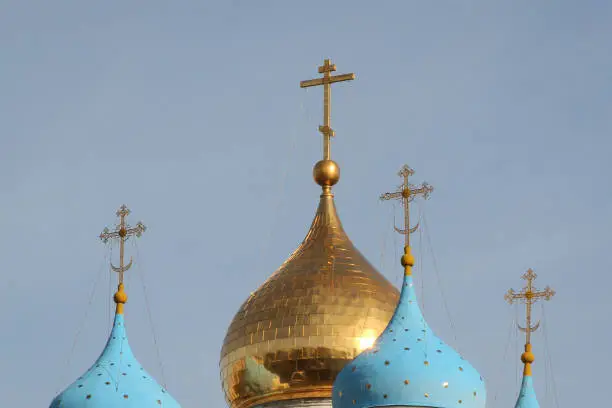 Blue and golden domes and religious crosses of the church at Novospassky convent. Moscow, Russia.