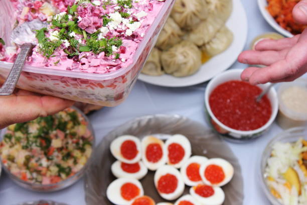 Russian feast. Traditional new year's dish - salad herring under a fur coat. Russian Festive table.
