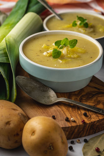 Leek and Potato soup Close up of leek and potato soup in ceramic bowls healthy eating red above studio shot stock pictures, royalty-free photos & images