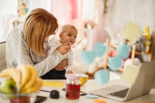 istock Snack time for a home working mother and her baby 1197470096