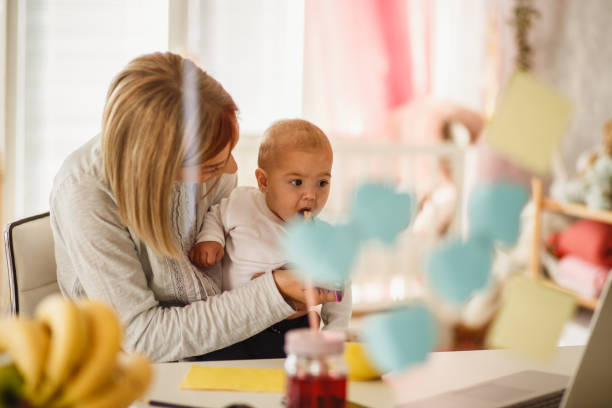 istock Quick snack for a baby being held by her mom 1197470100