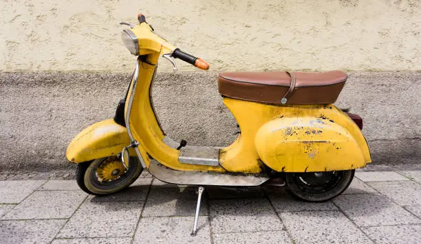 Old Vespa on the sidewalk