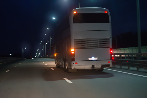 Bus Moves Over Night Illuminated Highway