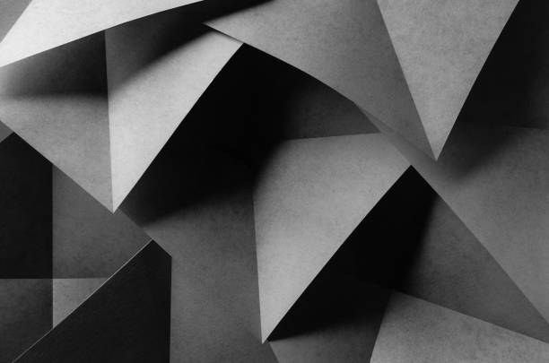 istock Geometric shapes made paper, dark background 1197474154