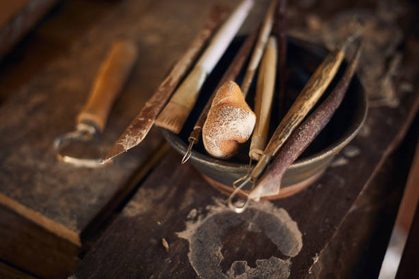 istock Tools for forming clay on  wooden background. 1197474442