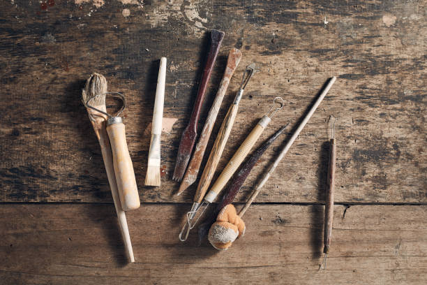 istock Tools for forming clay on  wooden background. 1197474467