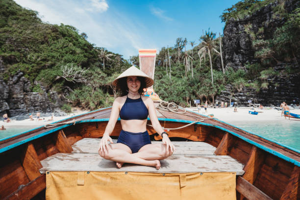 istock Young woman on a longtail boat in Thailand, Phi Phi Island 1197475815