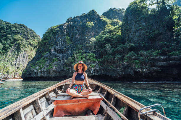 istock Young woman on a longtail boat in Thailand, Phi Phi Island 1197475819