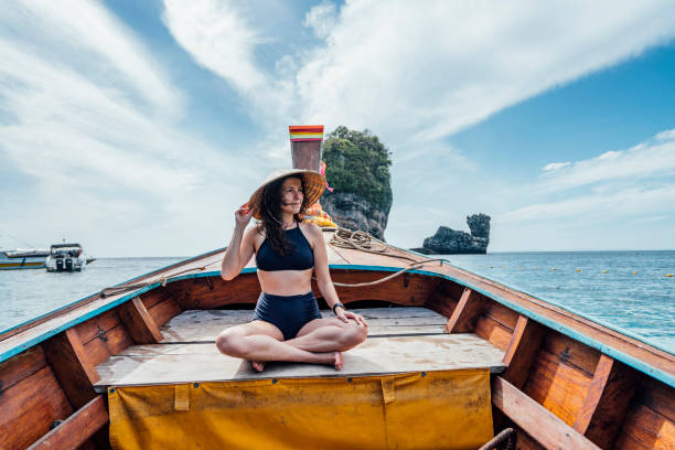 istock Young woman on a longtail boat in Thailand, Phi Phi Island 1197475831