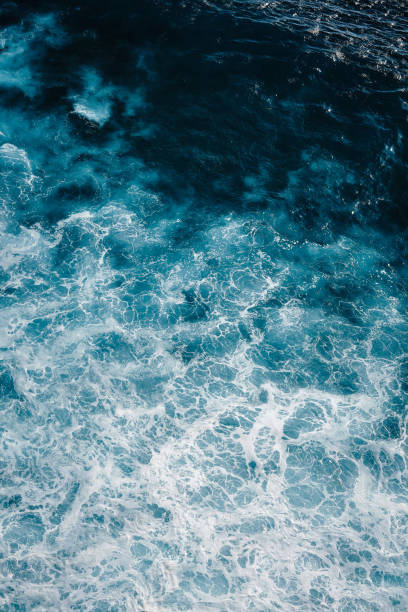 istock Aerial view to ocean waves. Blue water background. 1197476826