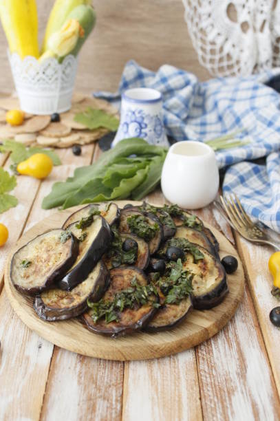 istock spicy eggplant with tomato sauce and cilantro. Grilled eggplant. 1197476852