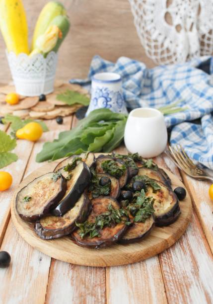 istock spicy eggplant with tomato sauce and cilantro. Grilled eggplant. 1197476867