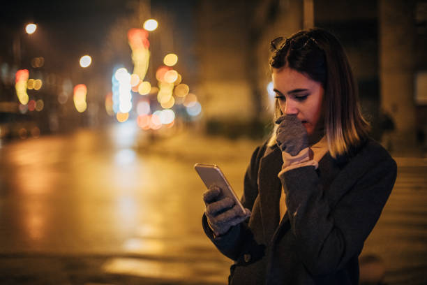istock Young woman using mobile phone in the city 1197477666