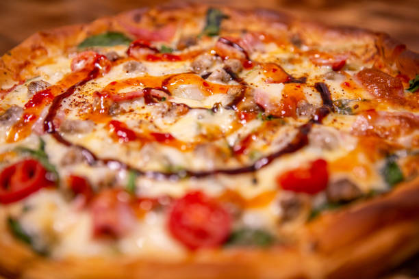 istock pizza with Pepperoni with vegetables and fresh ingredients on rustic wooden table 1197477837